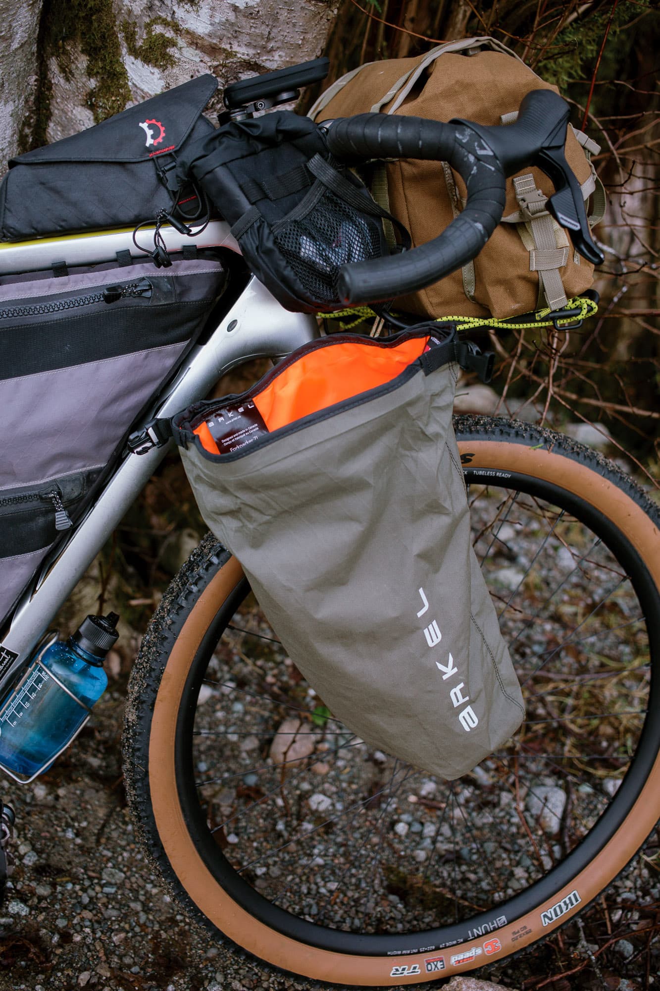Three-quarter view of the loaded bike on pavement.