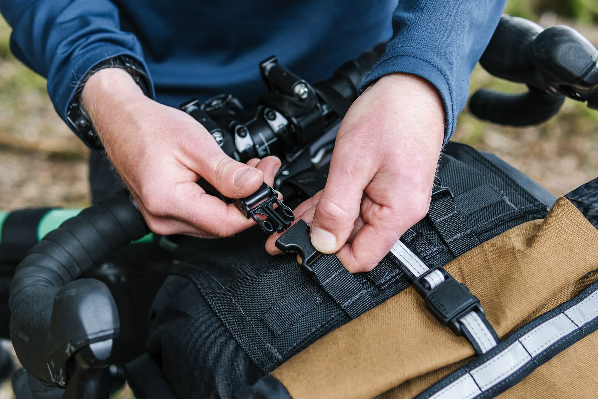 Snapping the bag in place.