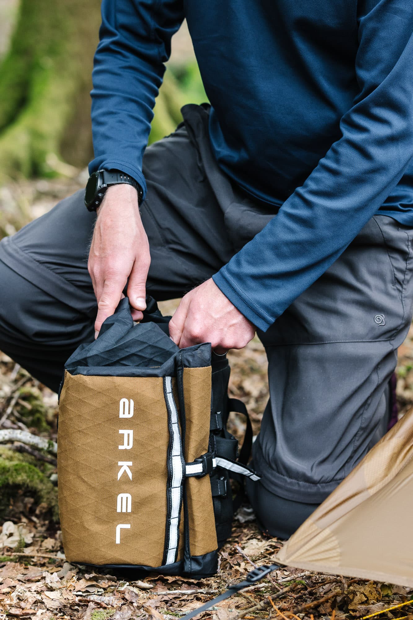 Clasping the Arkel Rollpacker Front.