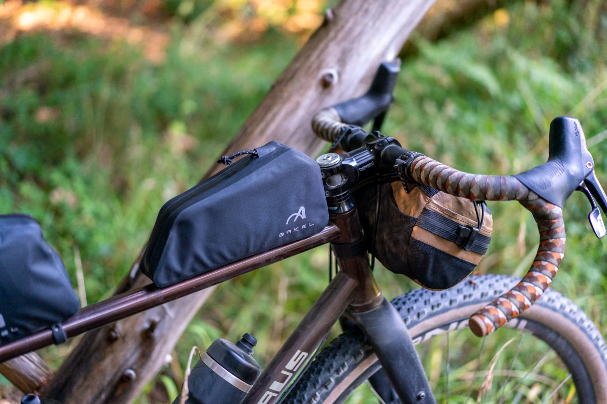 The front bag and burrito bag mounted near the handlebar.