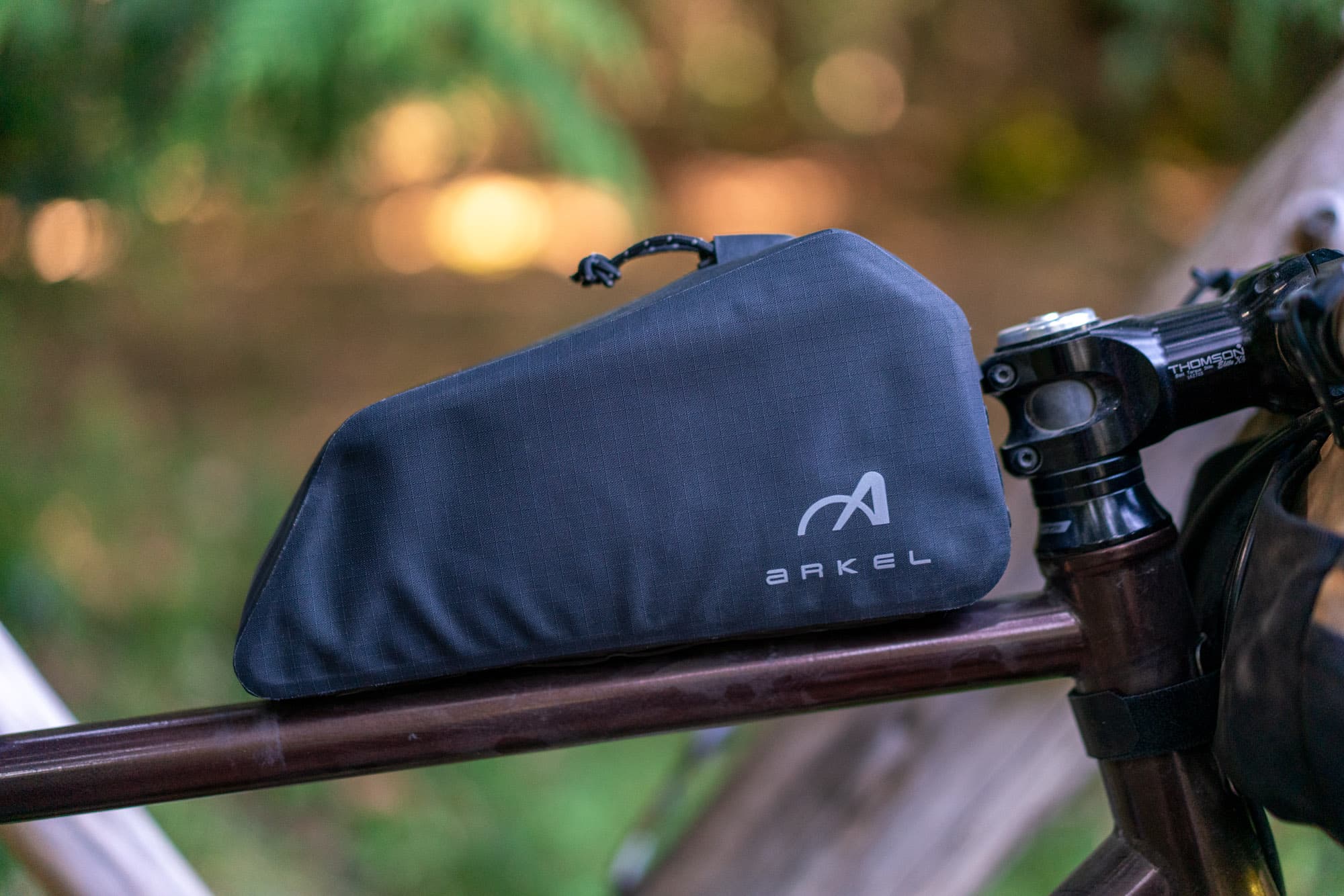 Close-up of the Arkel XP front bag mounted just behind the stem.