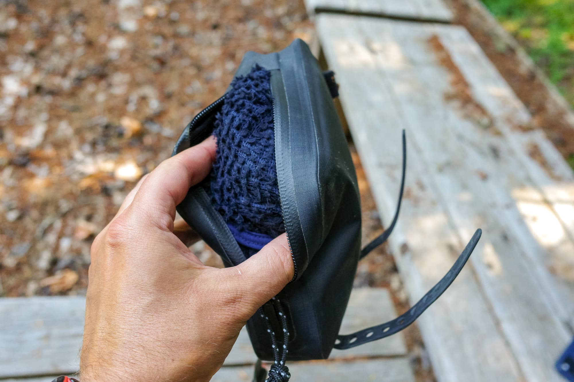 The front bag's mesh candy sleeve pulled out by hand.