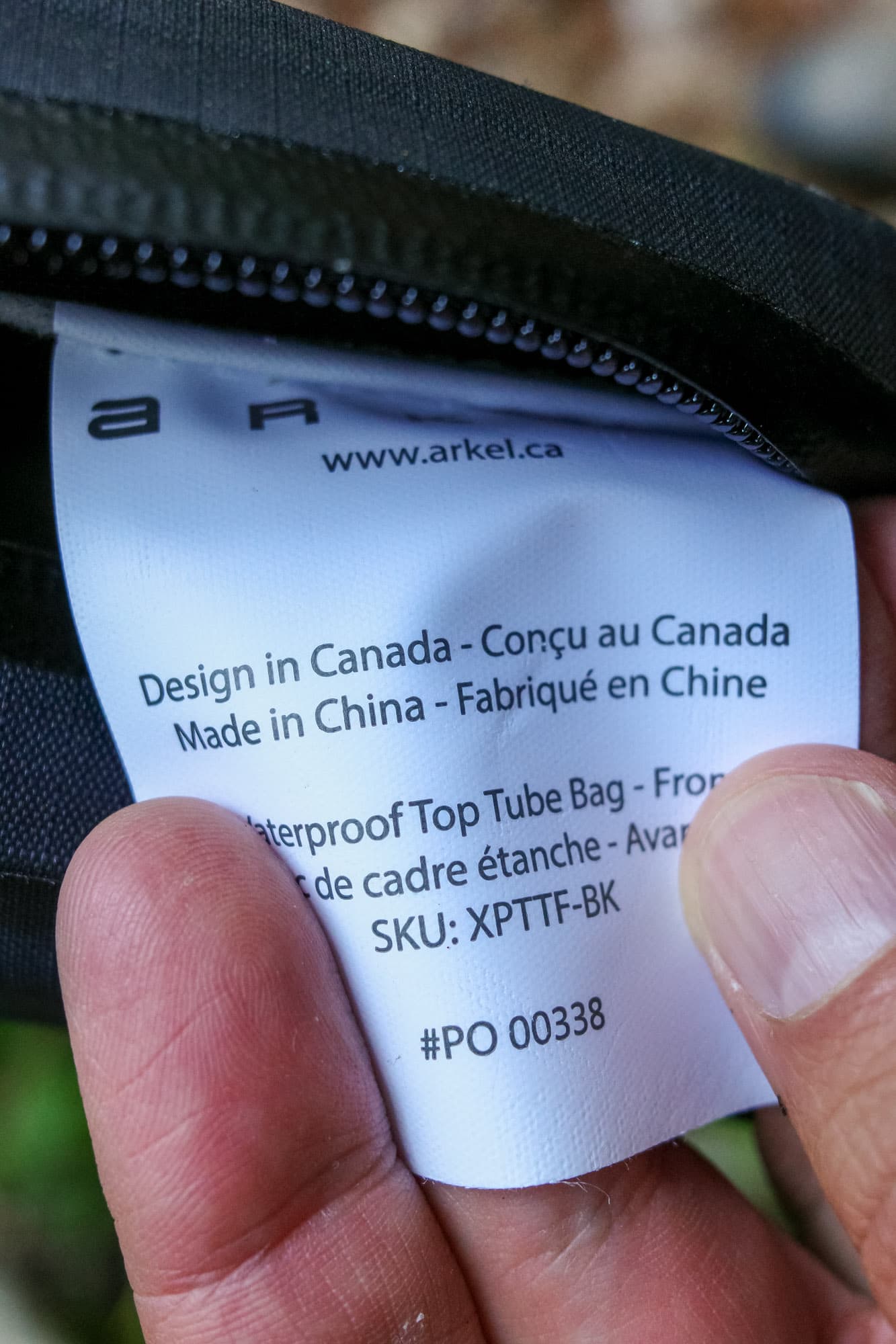 The front bag's manufacturing tag: designed in Canada, made in China.
