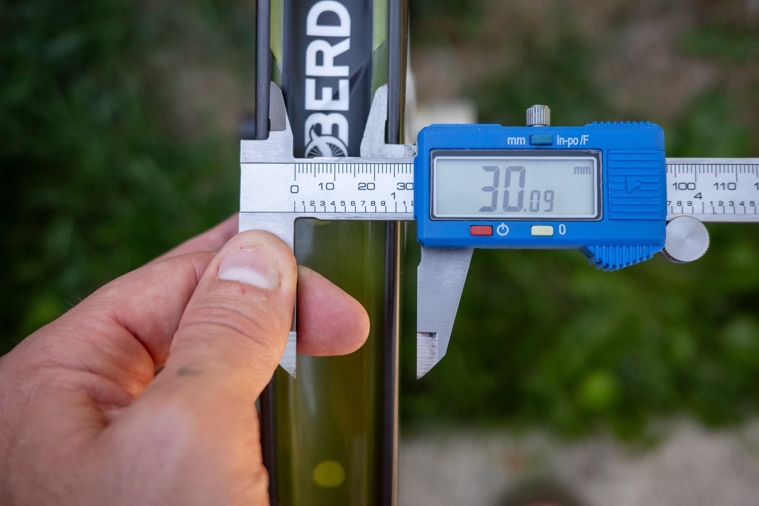 A second caliper check further down the same water bottle.