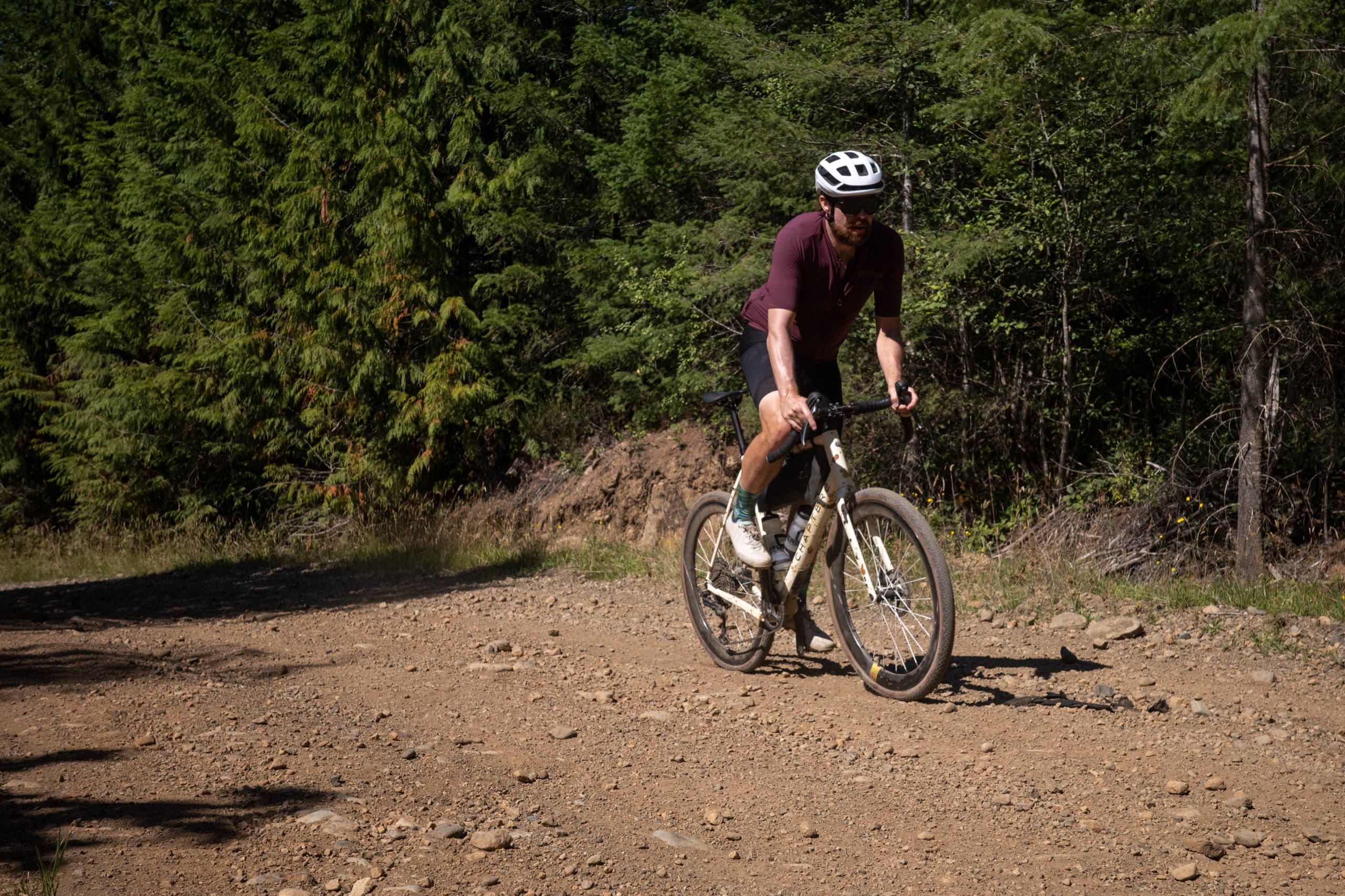 Jeff climbing a gravel road on the Comox Alberni Connector.