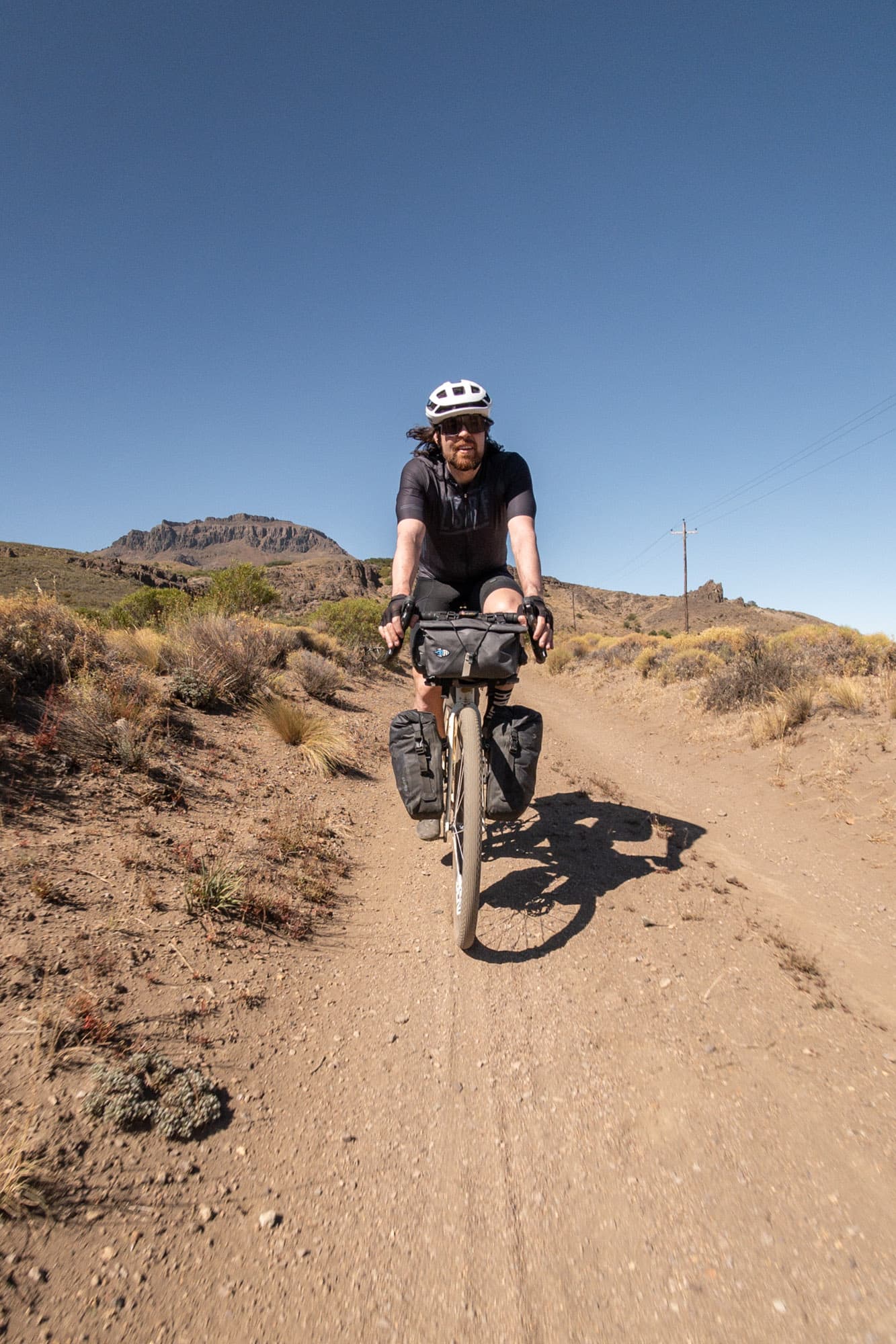 Riding the loaded gravel bike across the dry Patagonian Pampas.