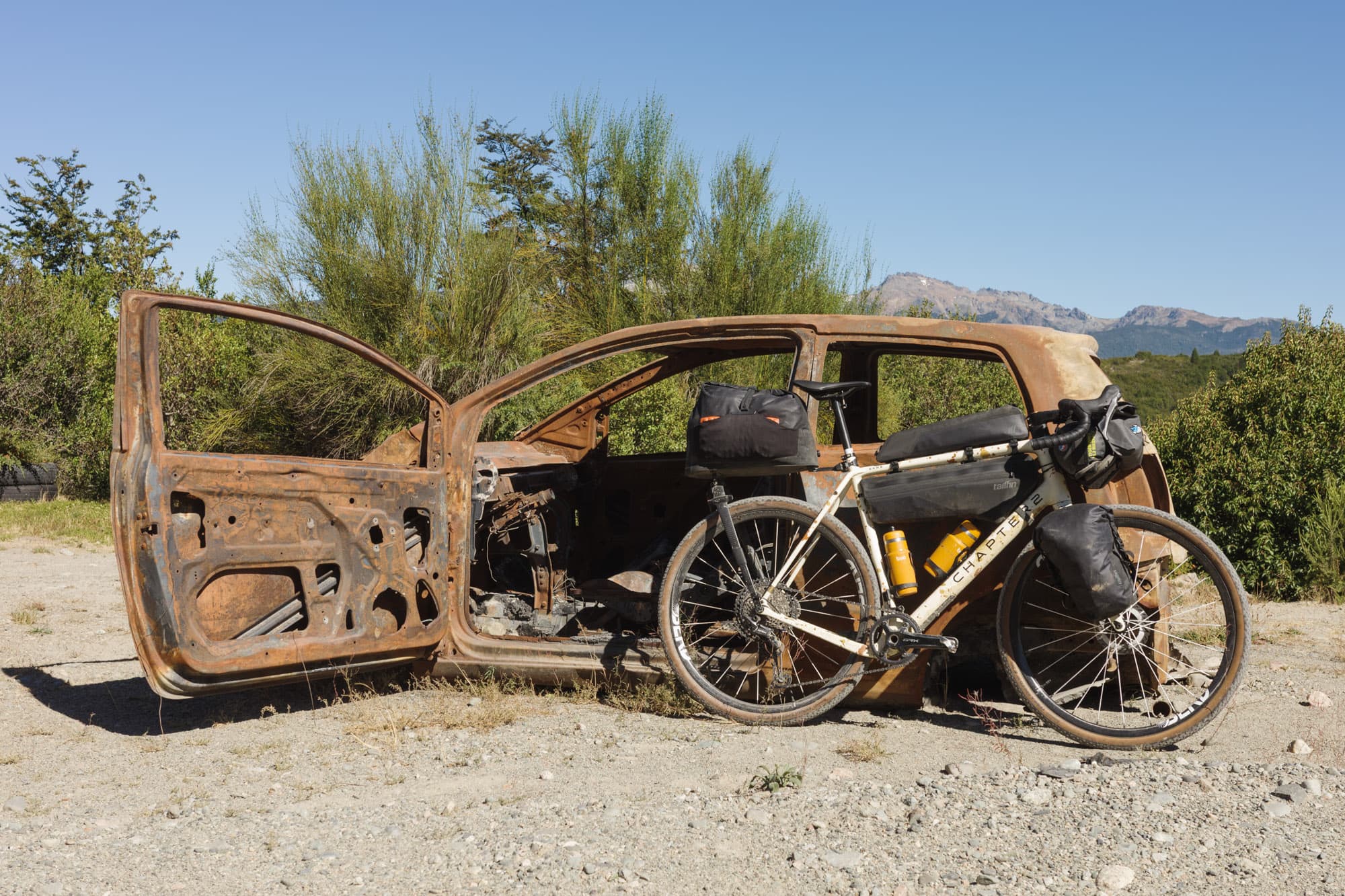 The loaded Kaha parked next to a burned-out abandoned car along the route.