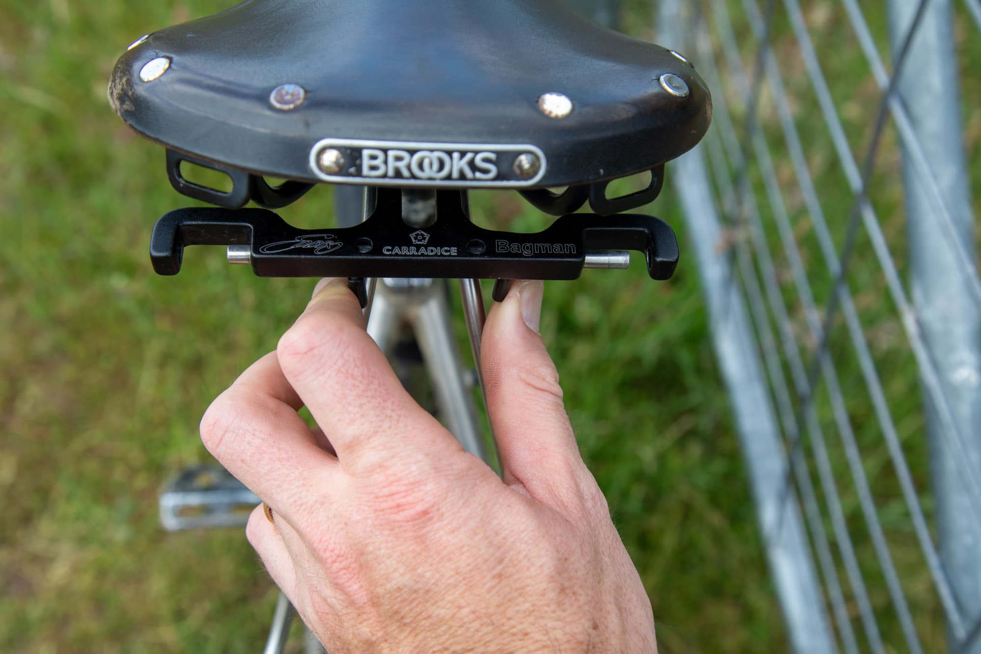 Attaching the bag's quick release to the Bagman rack by hand.