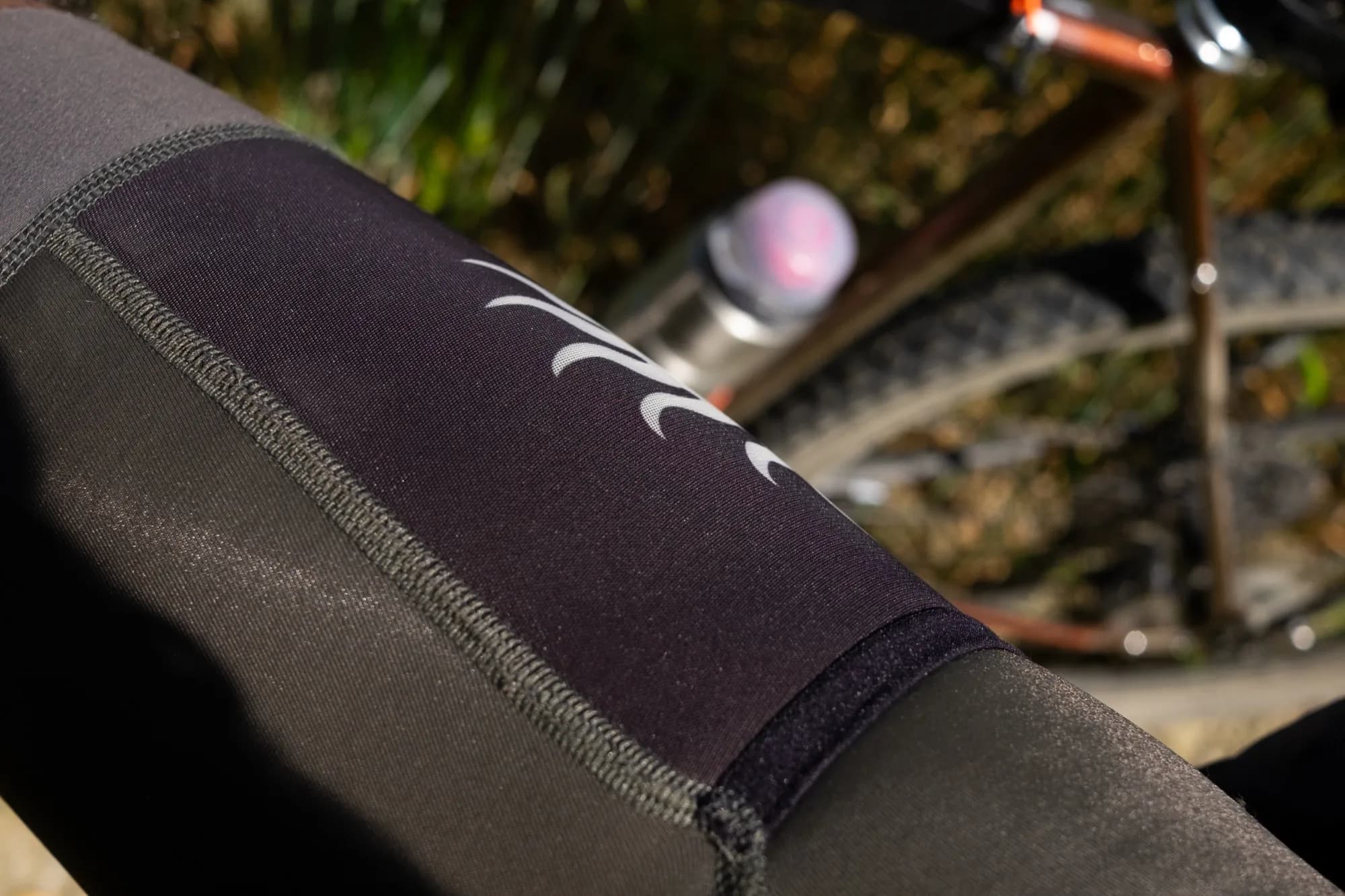 Close-up of the cargo bib shorts side leg panel and gripper in the sun