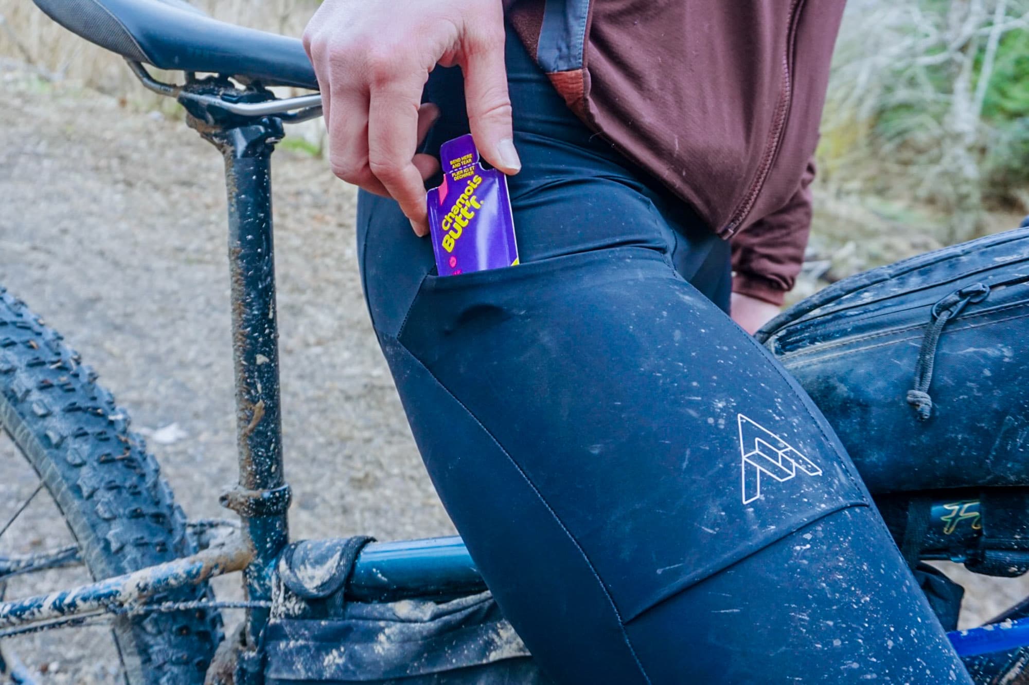 She stores it in her bib pocket.