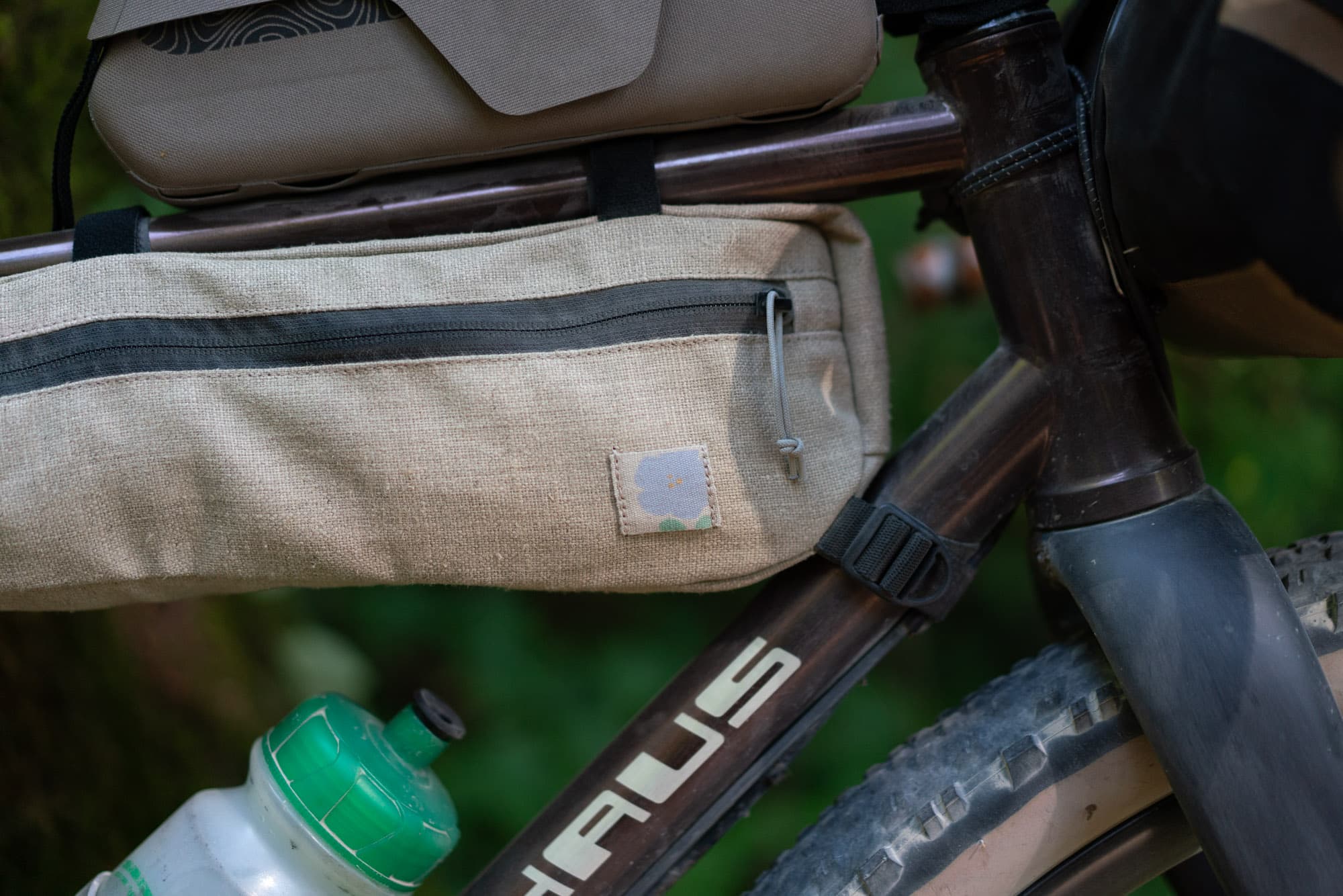 Weave and label detail on the half-frame bag.