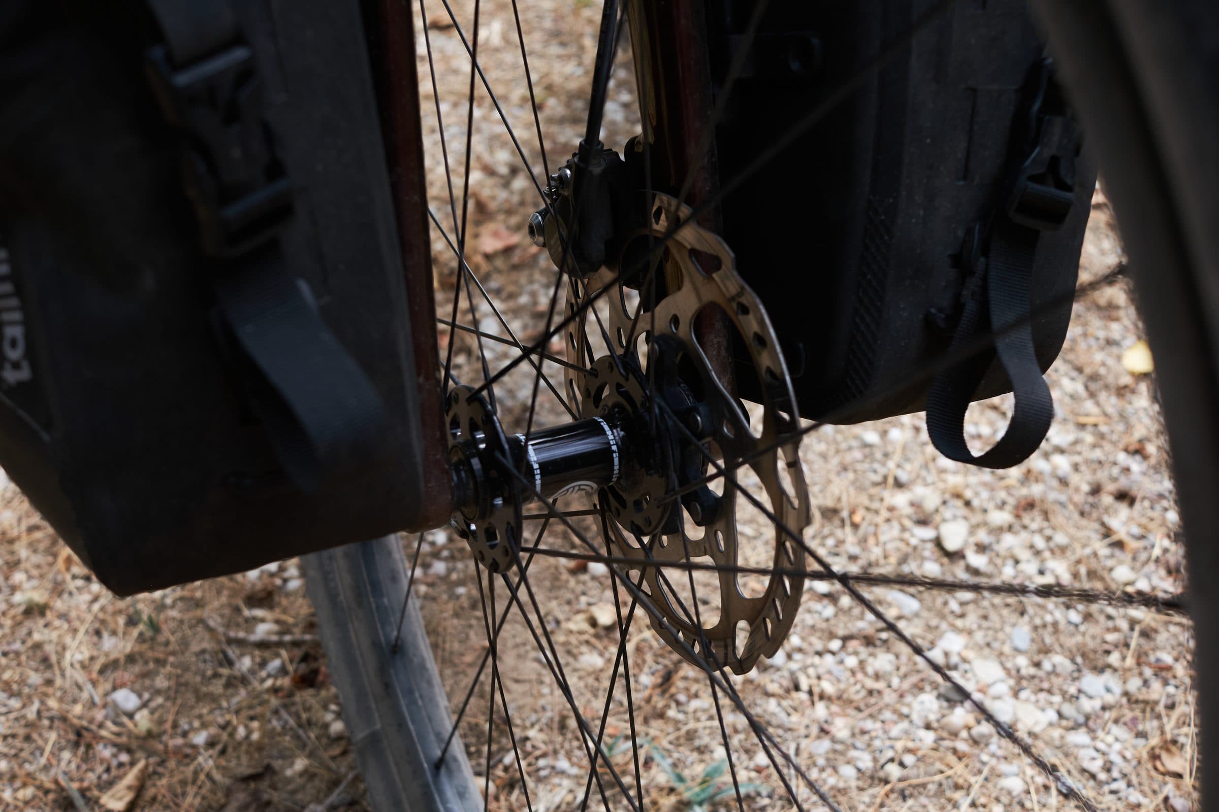 HiFi Fidelity front hub and disc rotor beside a fork bag.