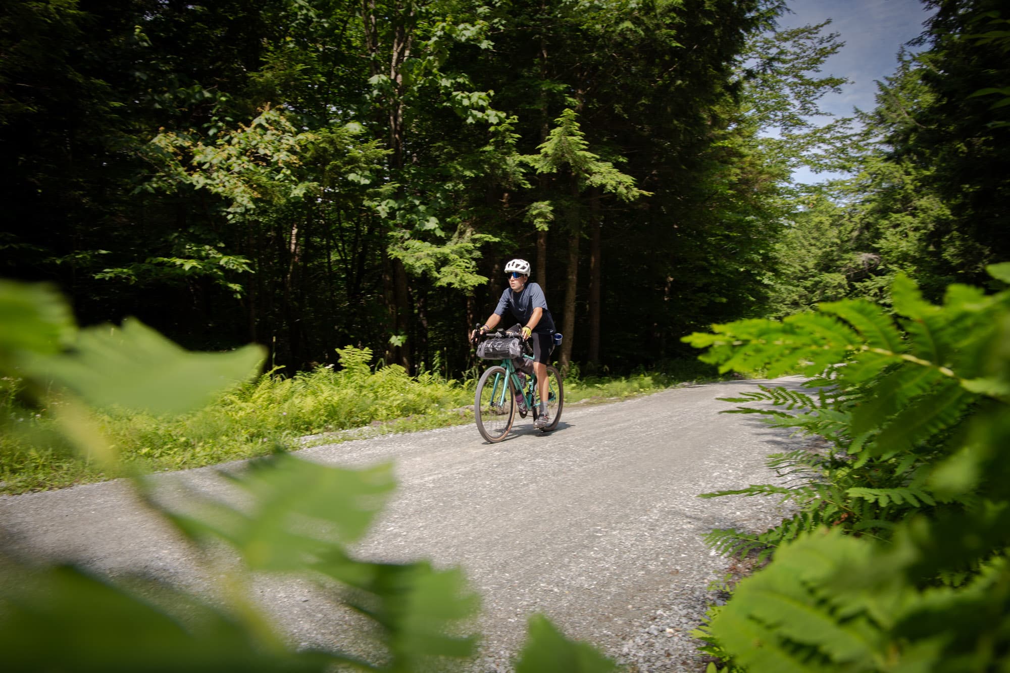 Trevors son rides the gravel of Quebec.