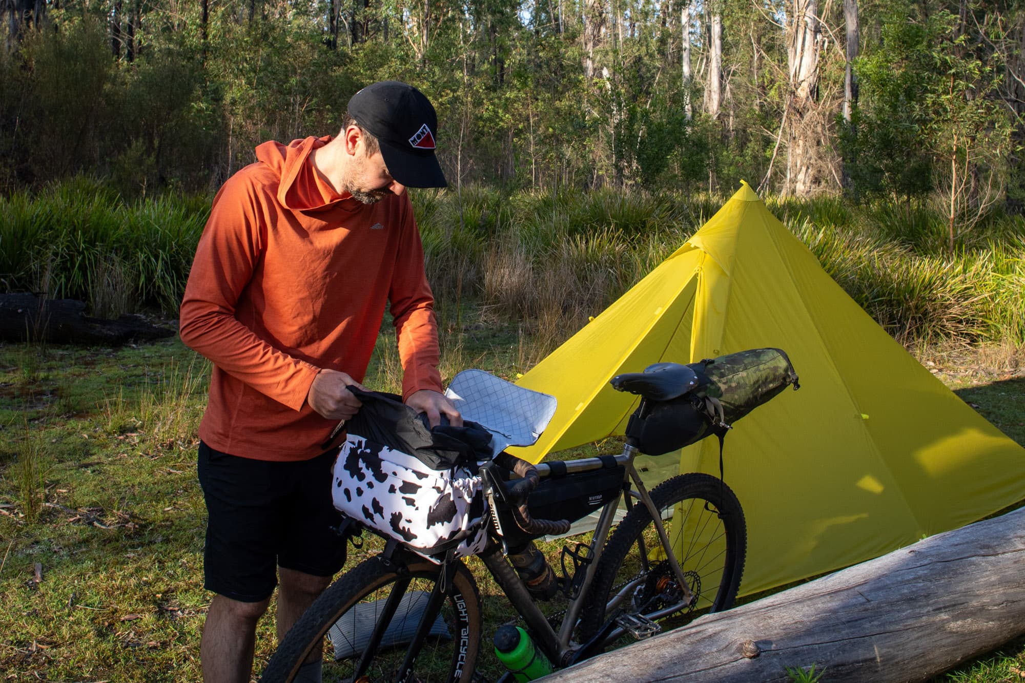 Mattie packs up after a night in the bush.