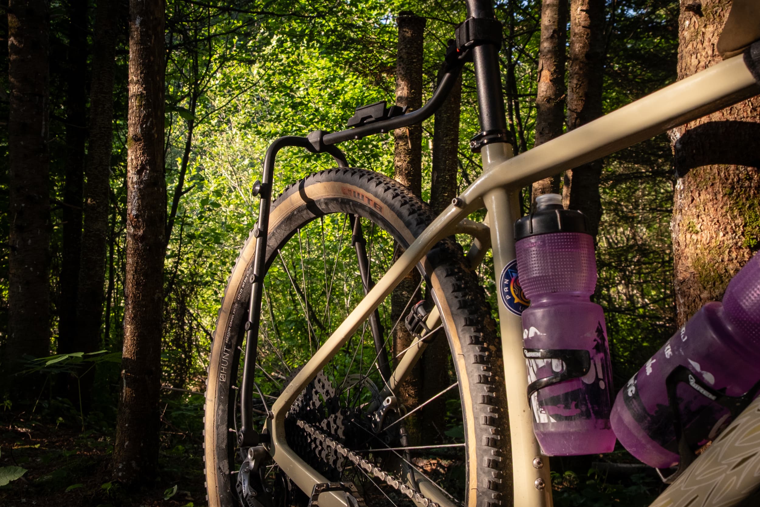 Switch Rack leg mounted to a thru-axle in the forest.