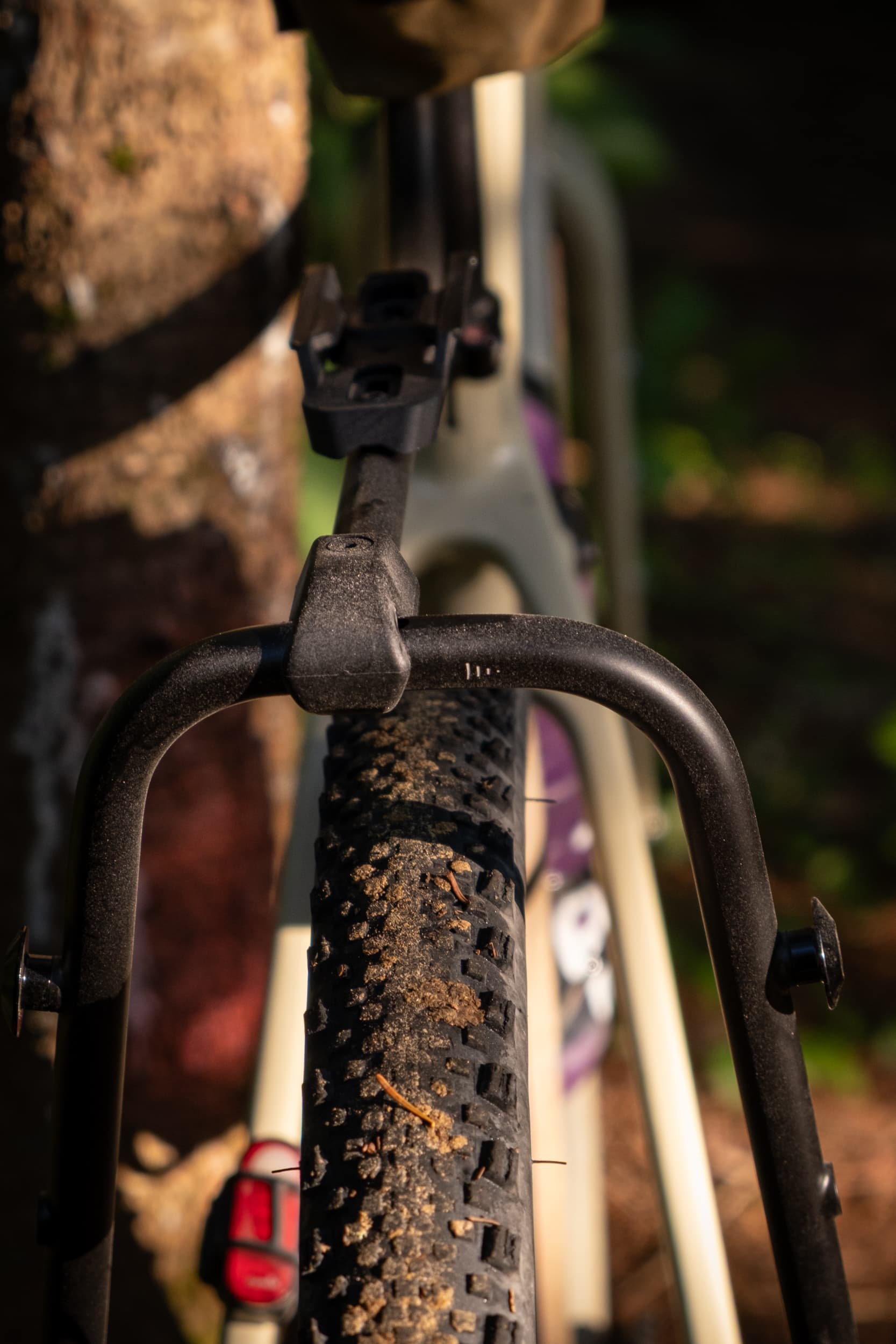 Switch Rack leg bracket against the rear tire.