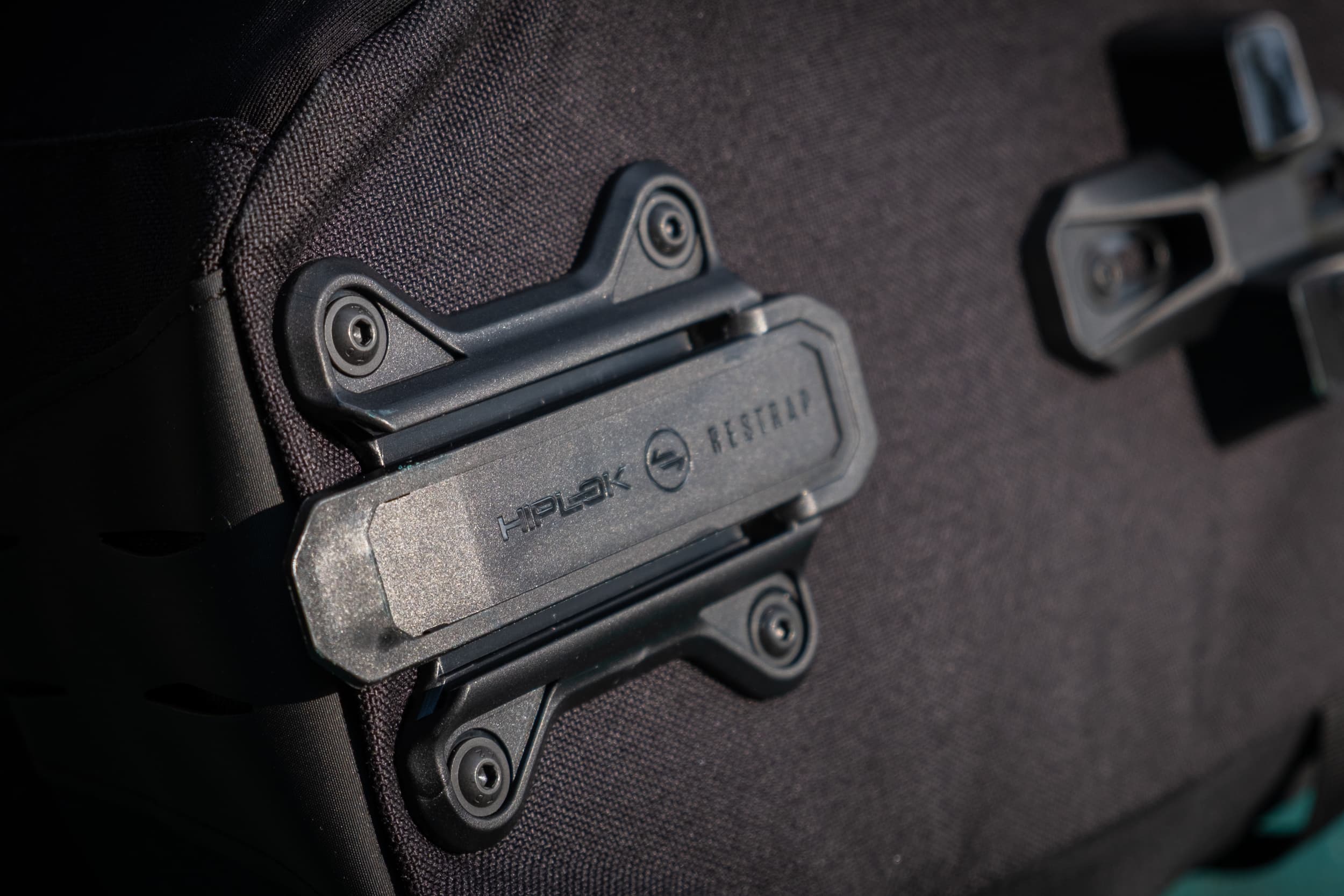 Switch Top Bag's Restrap x Hiplok branded security clip.