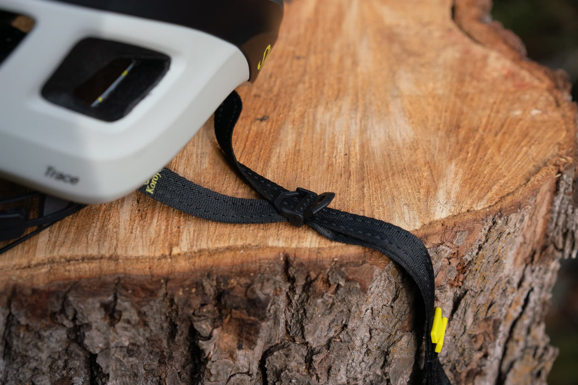 Close-up of the Smith Trace's straps draped over a stump.