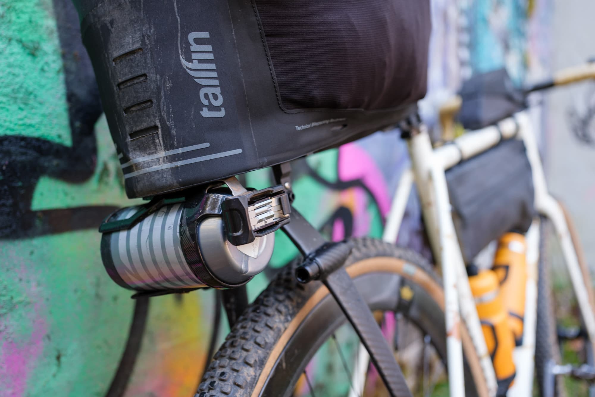A thermos on a bike bag.