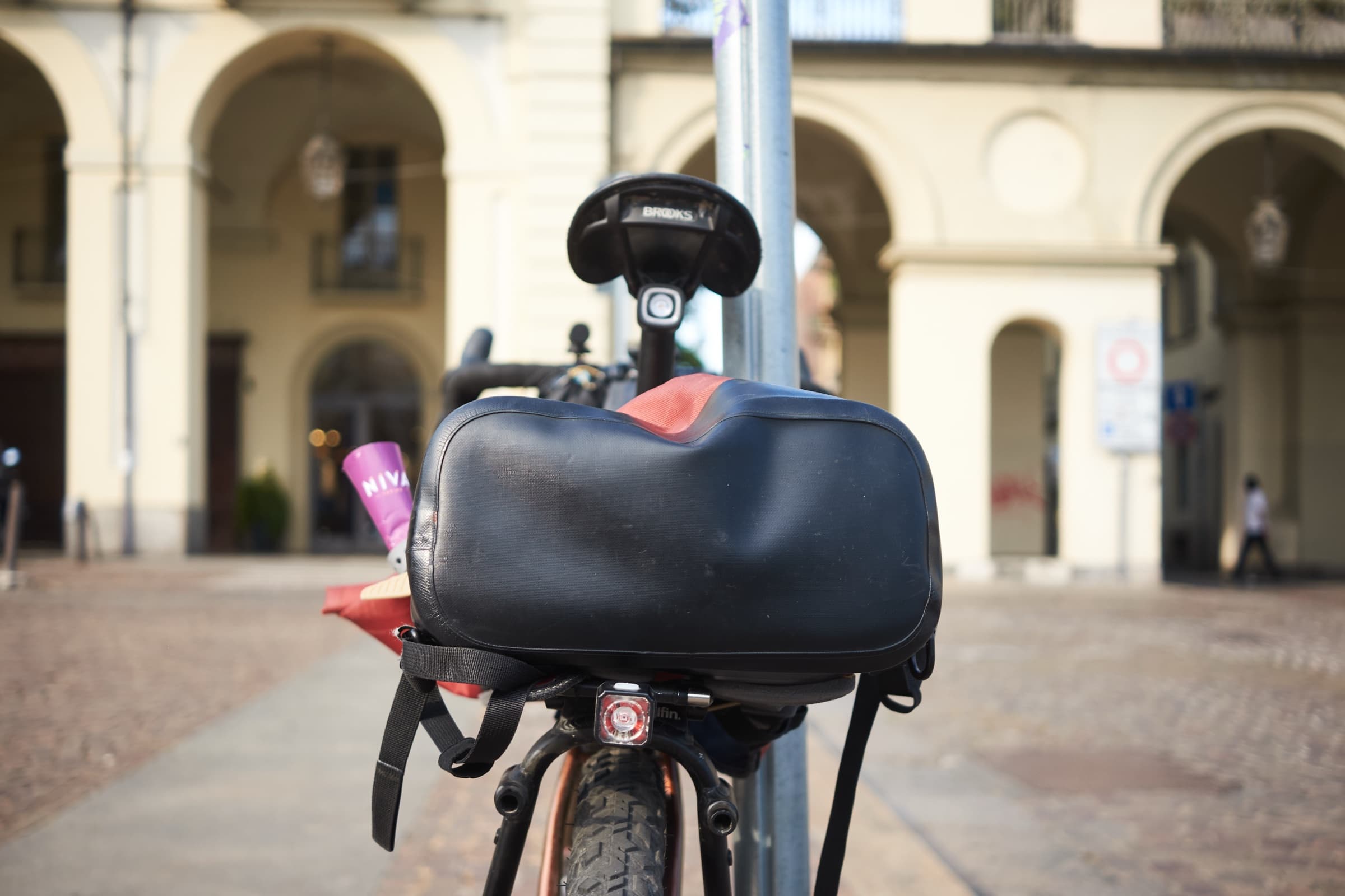 Close-up of the red bag strapped to the rack in Turin.