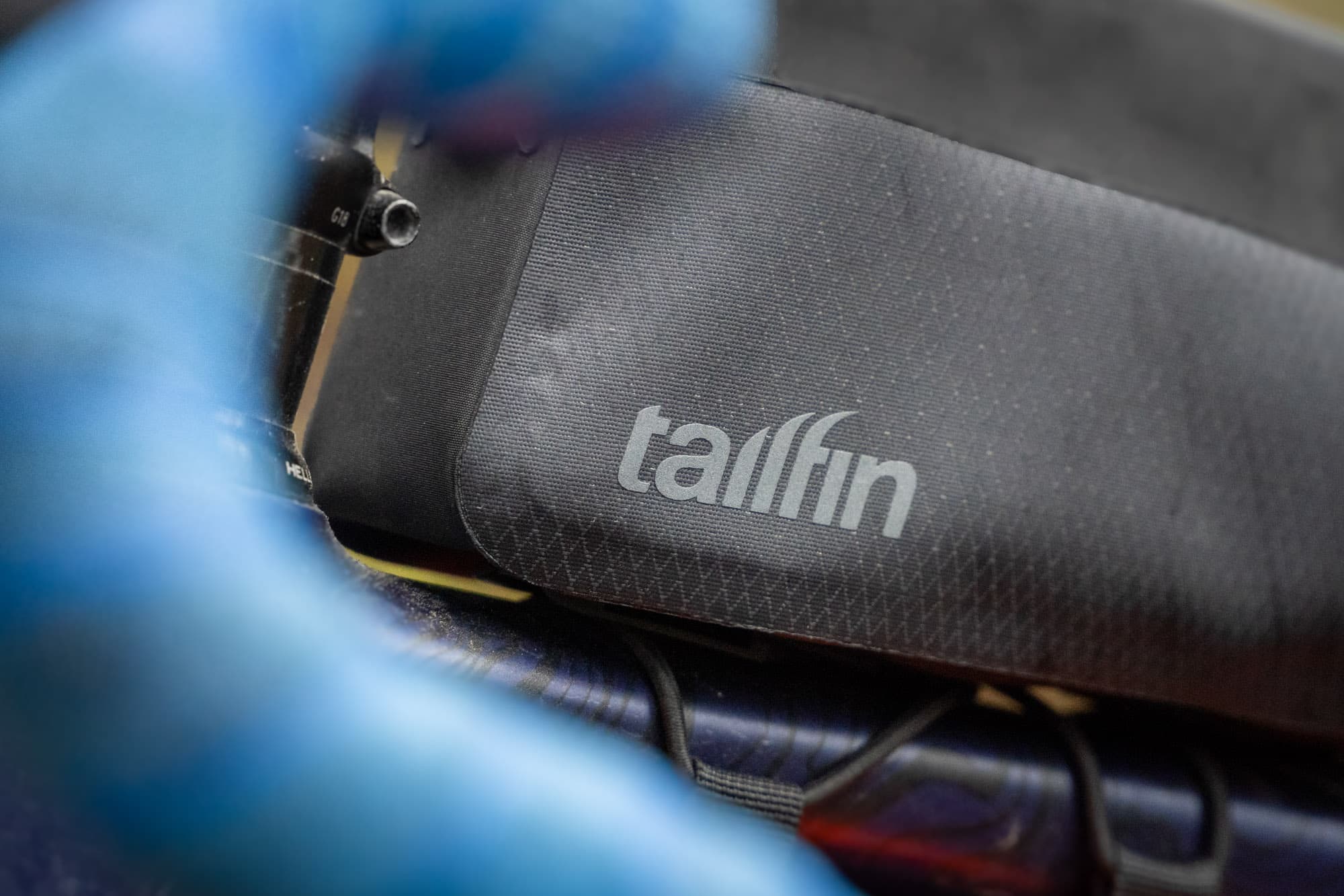 The logo on the Tailfin Long Top Tube Bag.