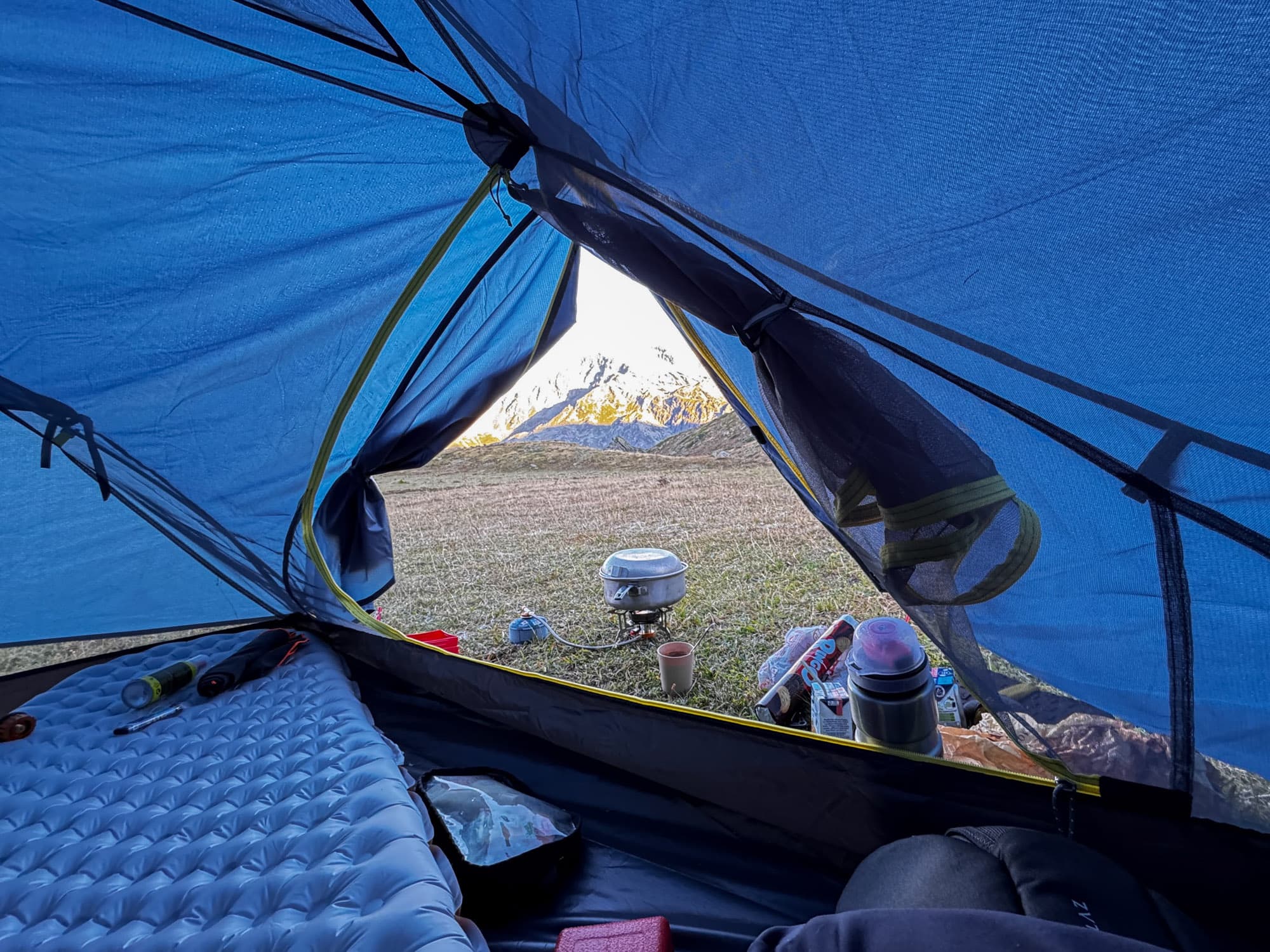 Tent pitched on rocky alpine surface