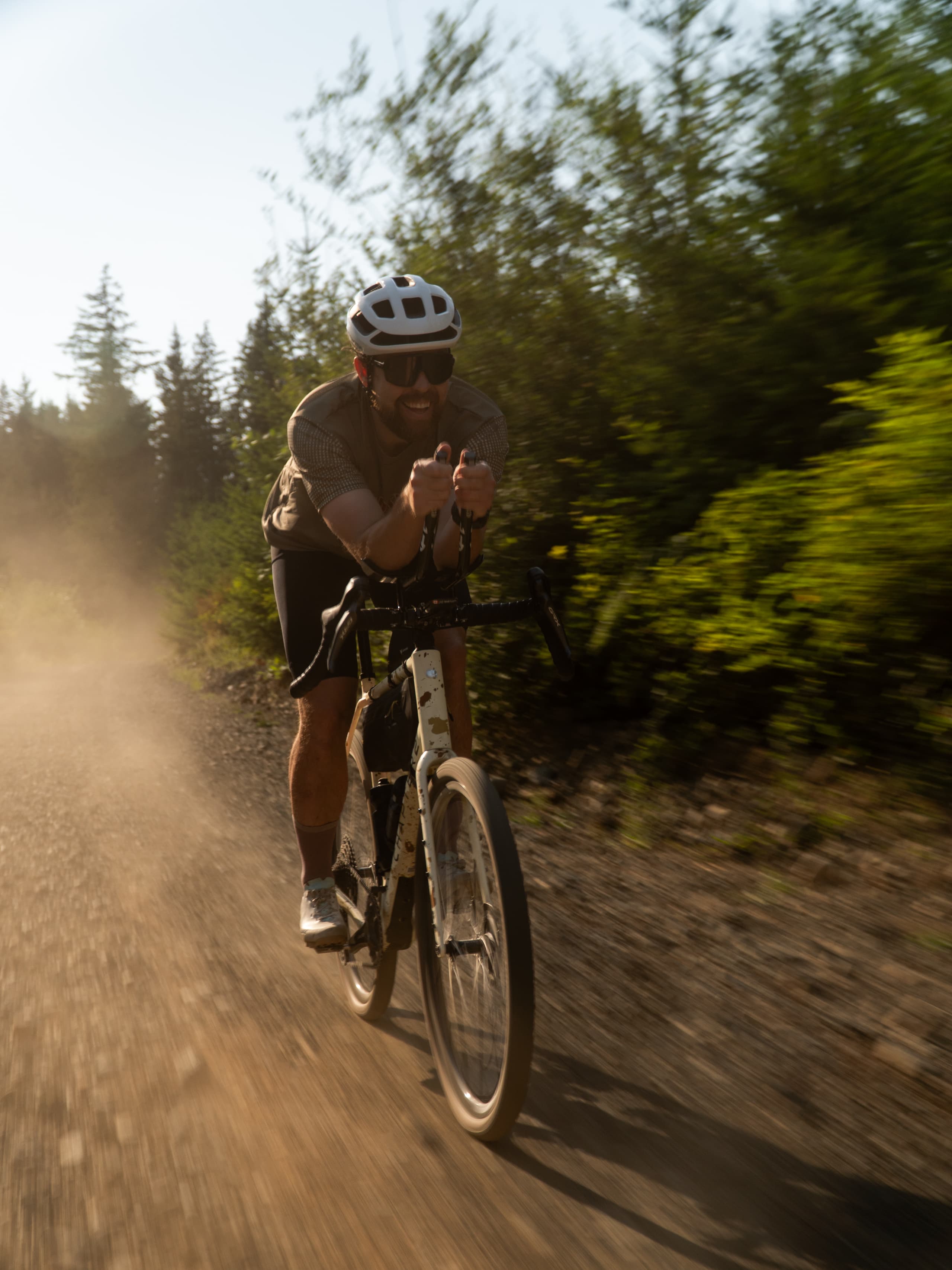 Climbing a dusty gravel grade.