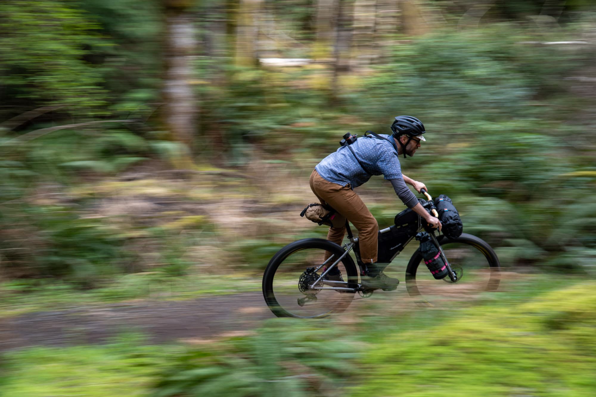 In the forest on a bike.