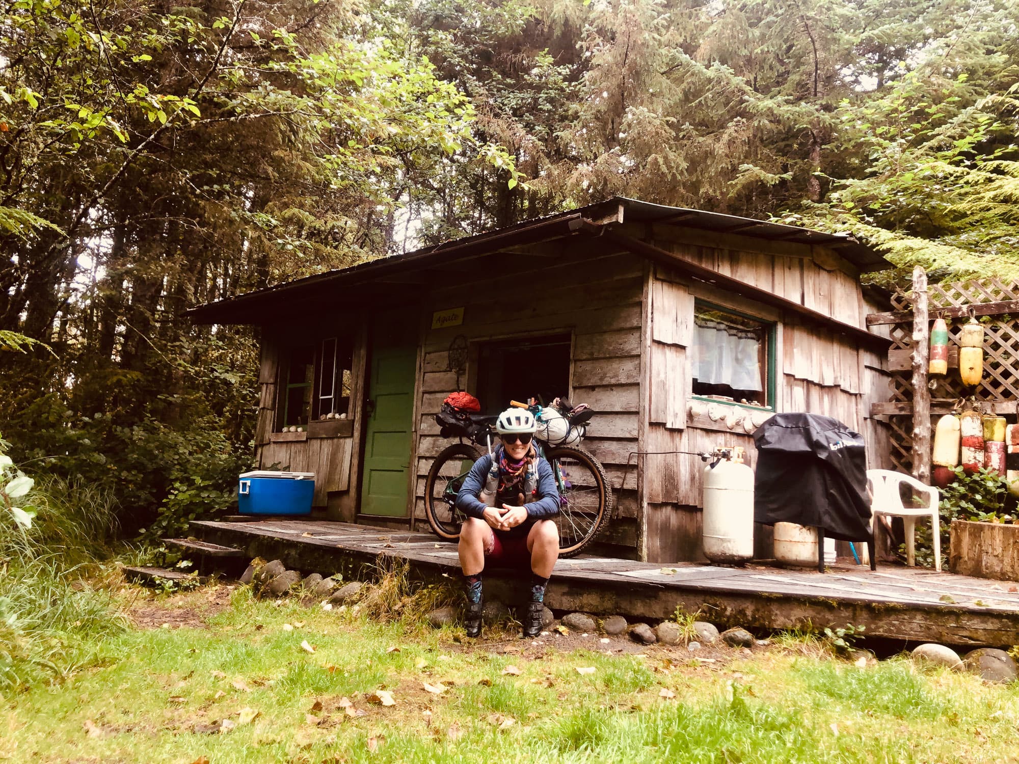 Sarah in front of the cabin.