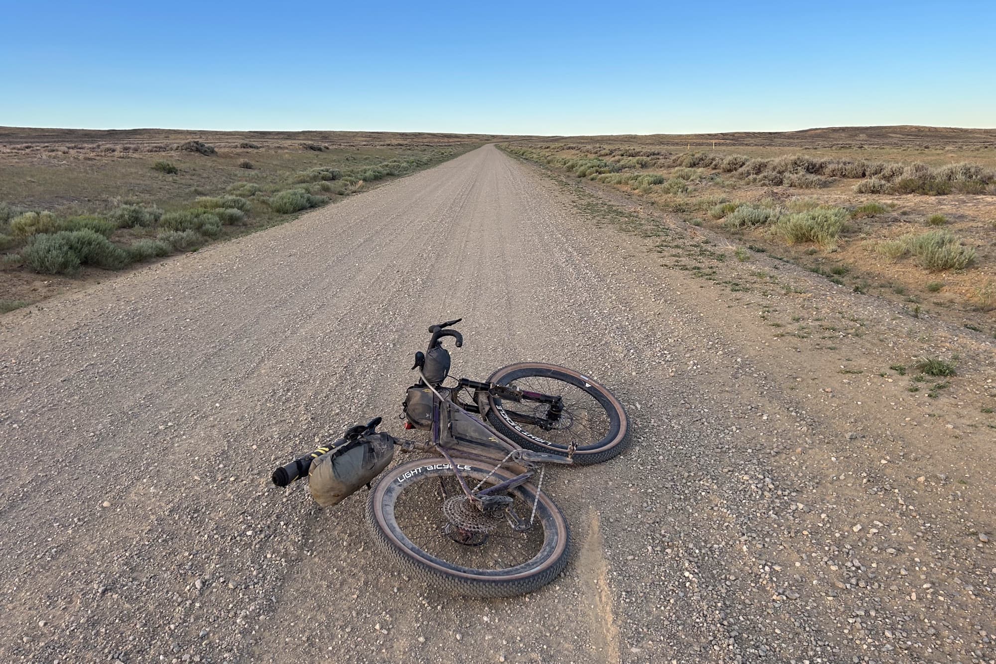 Meaghan's bike lies on an endless gravel road through the sagebrush of the Great Basin
