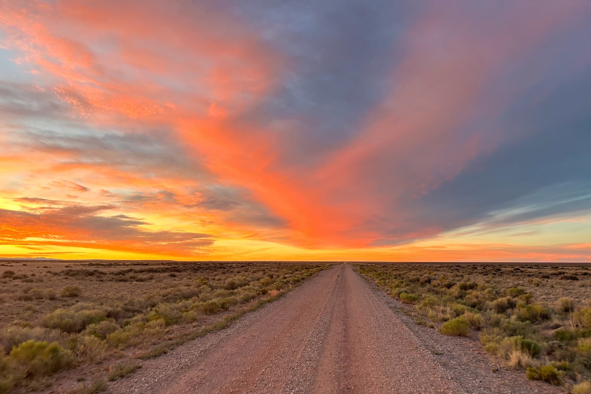 A fiery sky over the long gravel road through the Basin