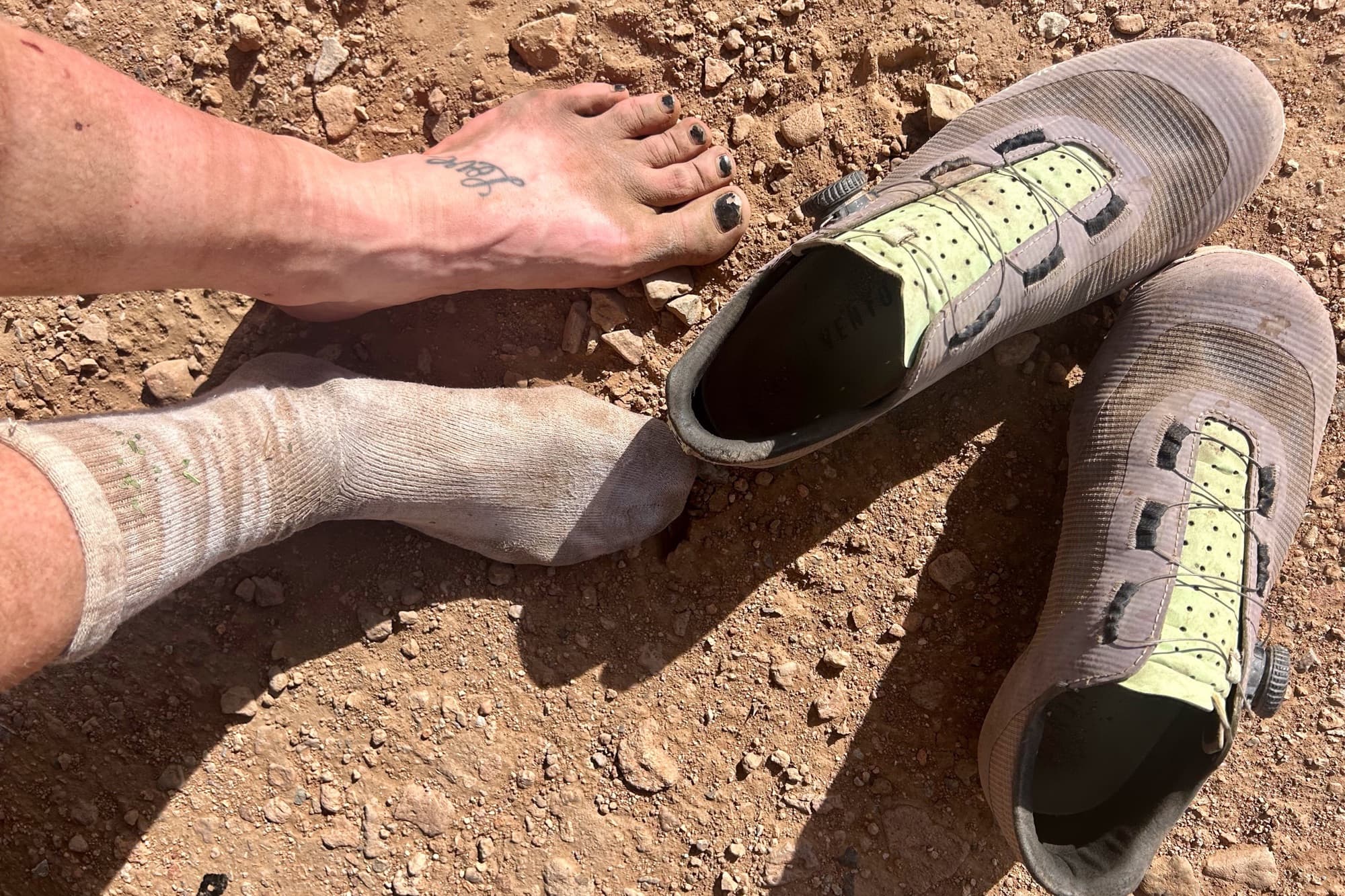 Shoes off: dusty feet and battered socks after days on the route