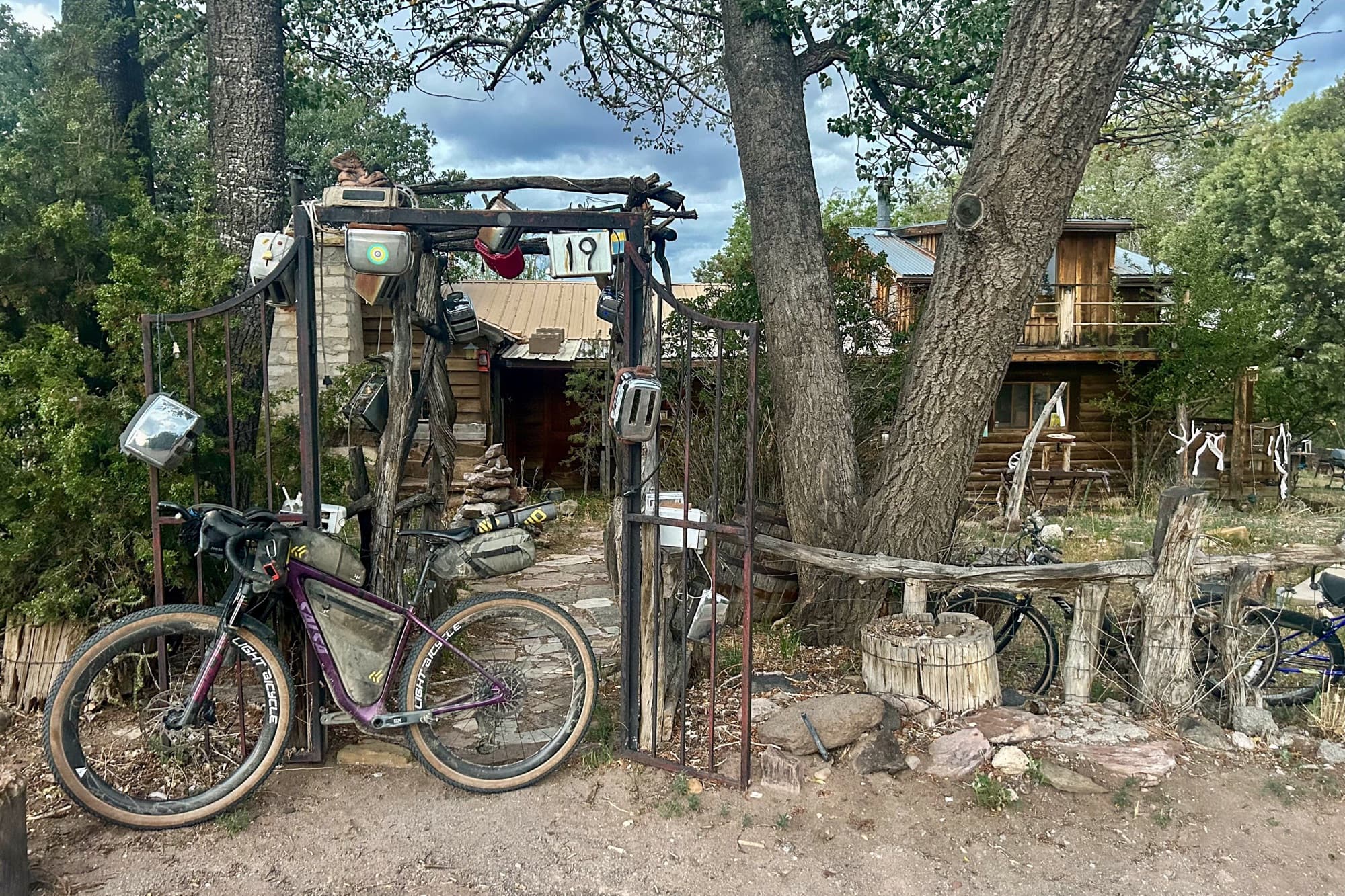 Dolly leans at the famous Toaster House gate in Pie Town, New Mexico