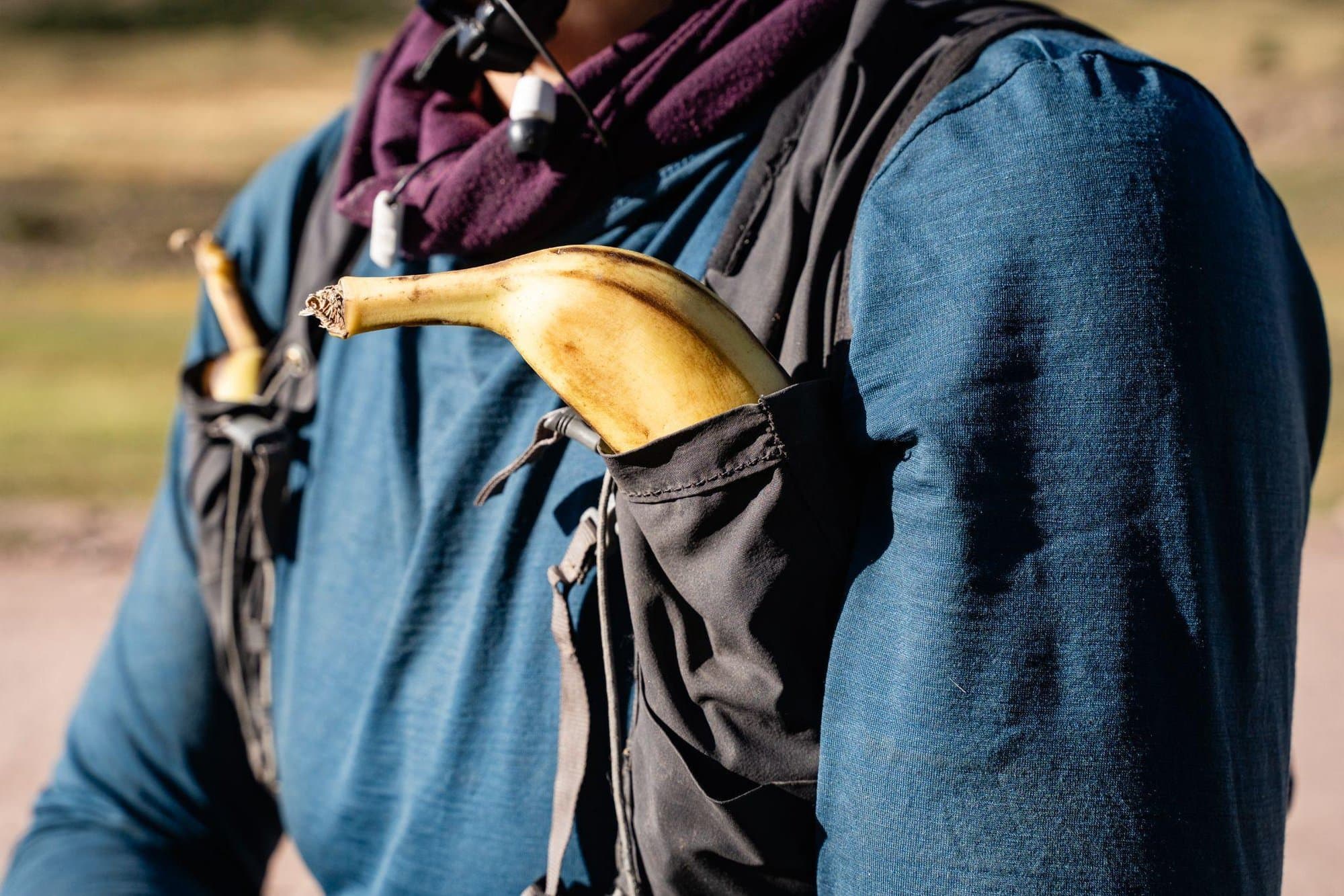 A banana tucked into the shoulder pocket of Britt's hydration vest.