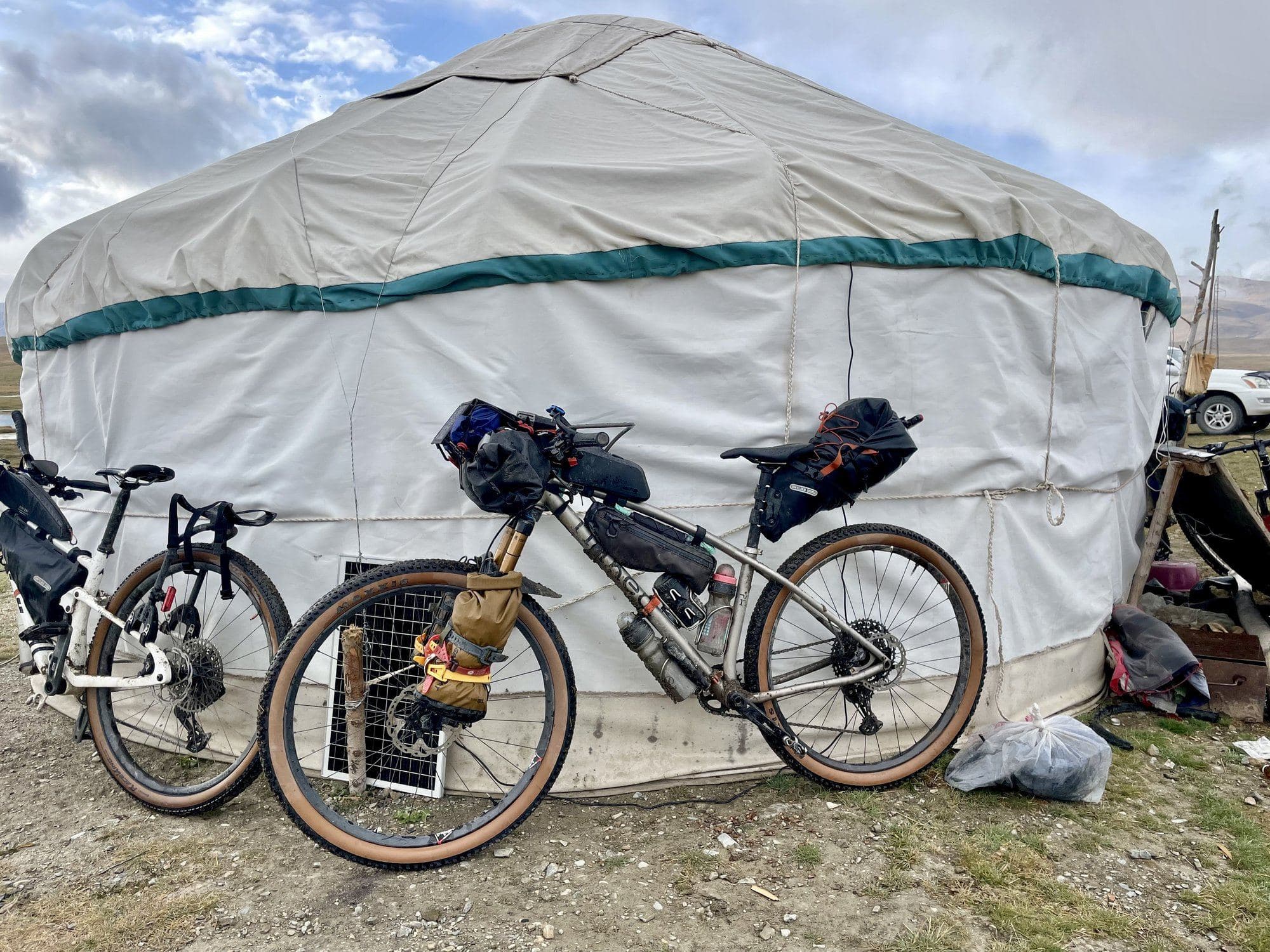 Britt's bike and another loaded rig leaning against a tea yurt on the race route.
