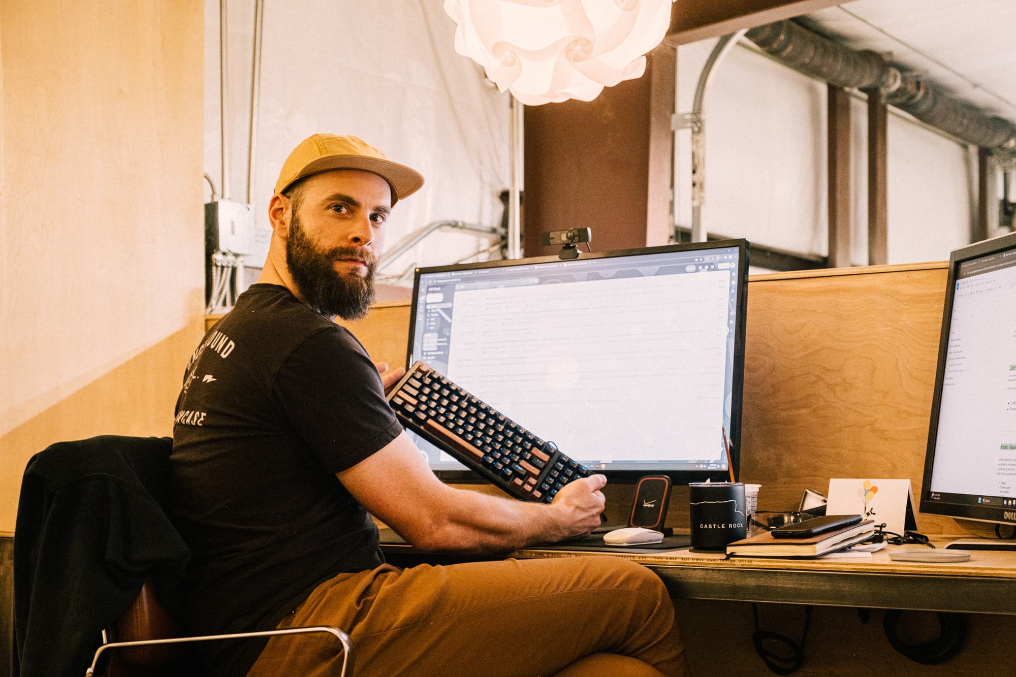 A team member sits at the computer.