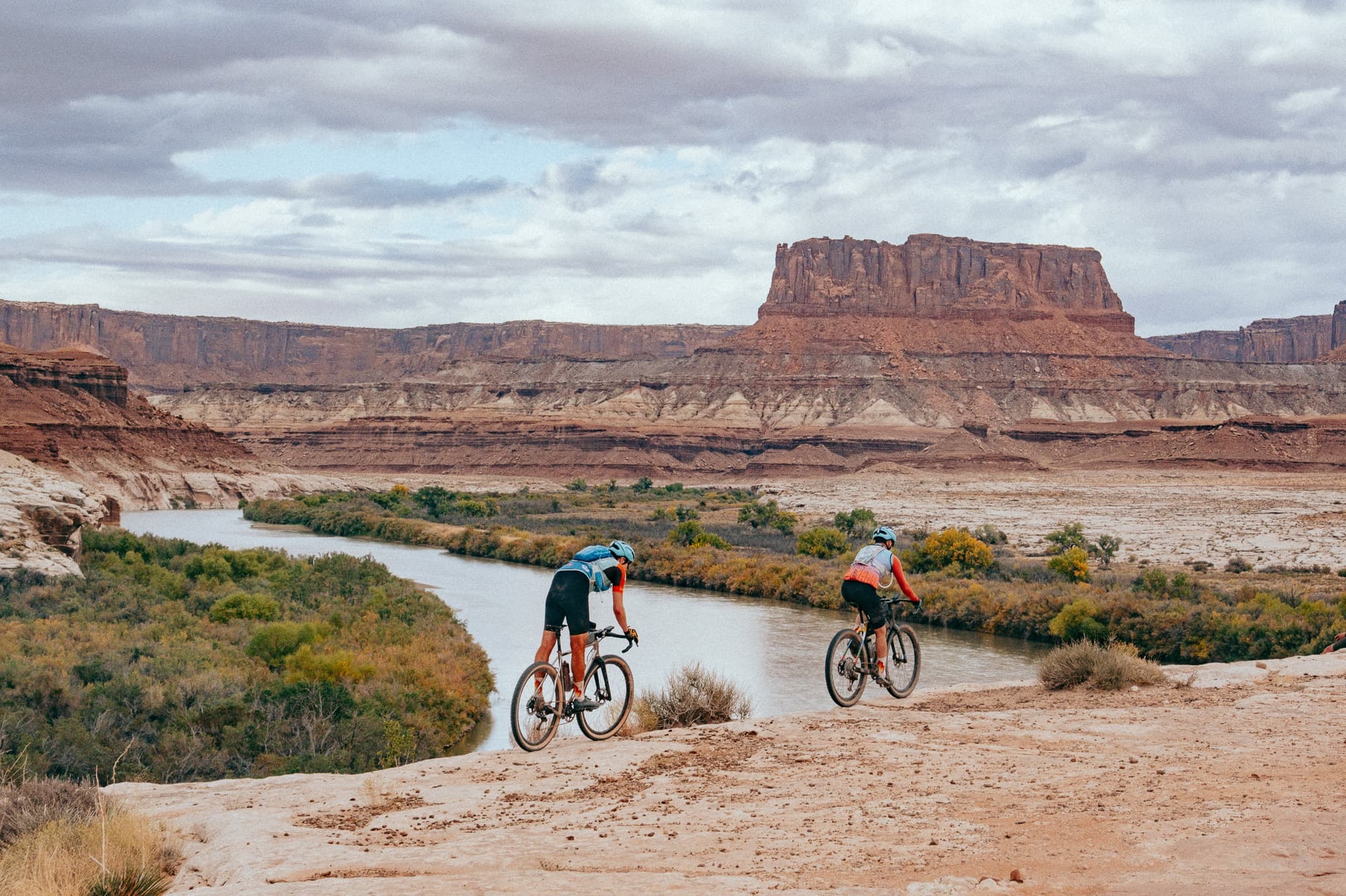 Riding gravel bikes along a river.