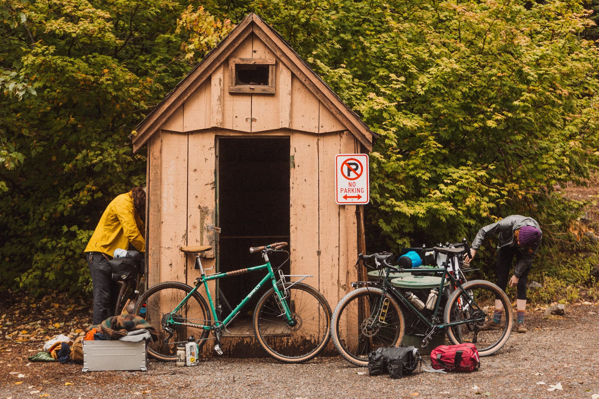 Two riders at Swift Campout packing up.