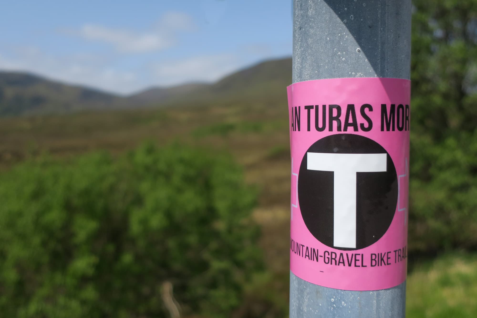 An Turas Mor sticker on a sign post.