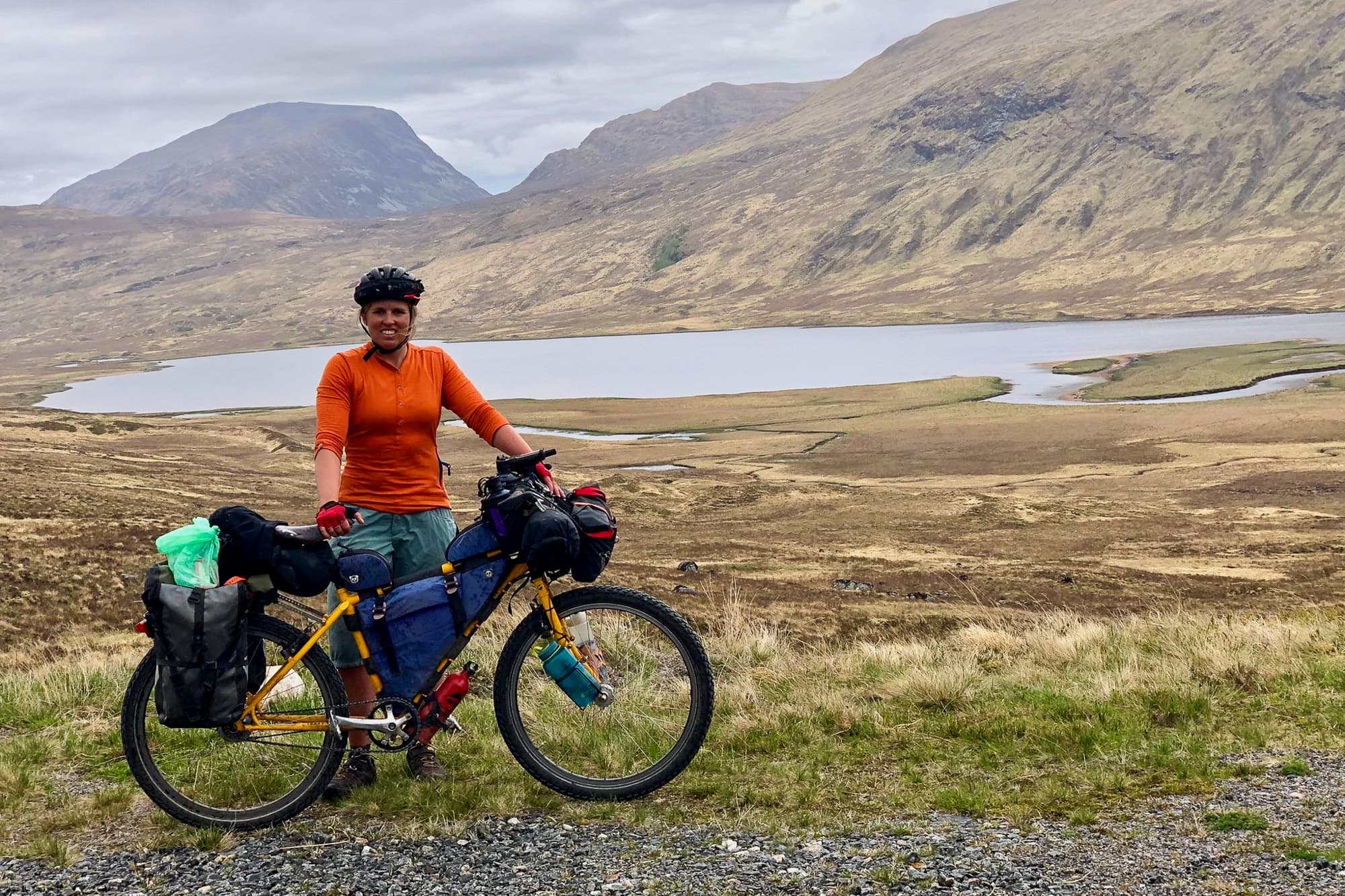 Tara takes a break in front of a loch.