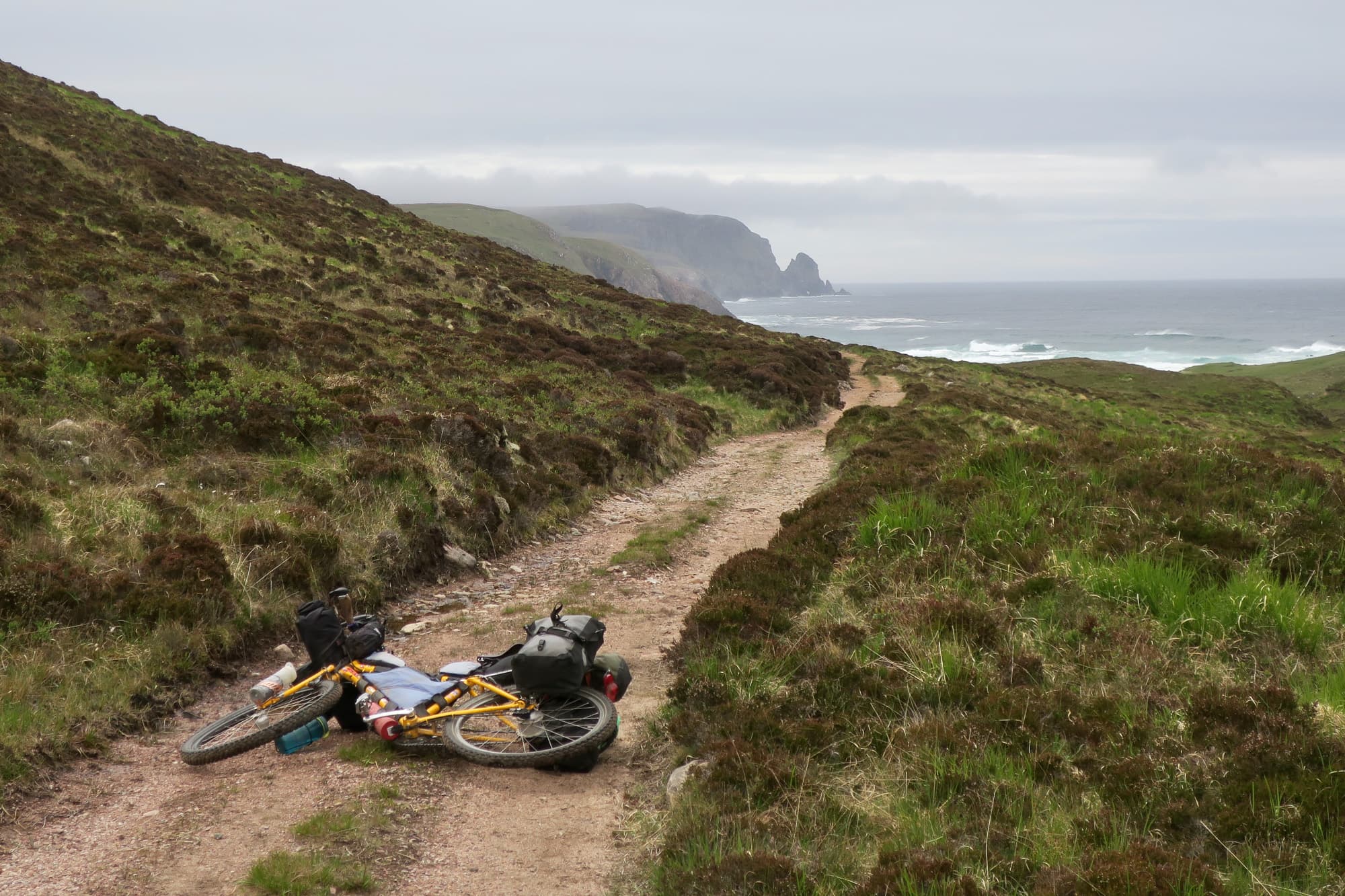Taras bike in front of rough waters.